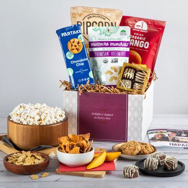 Sweet and Savory Delights gift box featuring popcorn, dried fruits, artisan cookies, and chocolate treats, ideal for employee gifts or virtual events